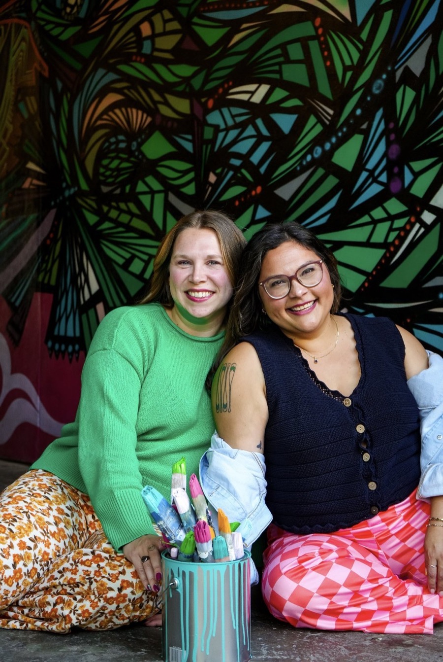 Jess and Christina live painting at an event